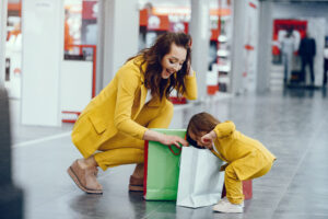 Mother and daughter with shopping bag