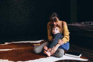 Mother with her son playing in the room