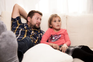 relaxed-father-looking-his-daughter