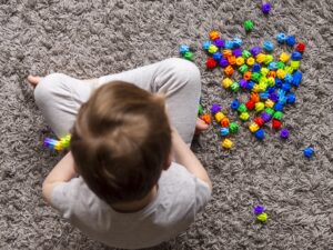 top-view-kid-playing-with-colorful-game