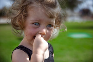 A little cute girl with an expressive close-up look.